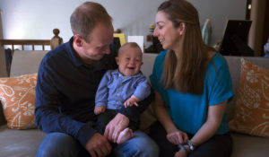 Mother and father with a baby with Down syndrome