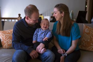 Mother and father with a baby with Down syndrome