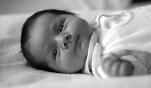 b/w photo of infant with black hair