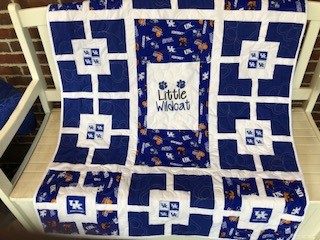 Quilt with blue and white UK branding