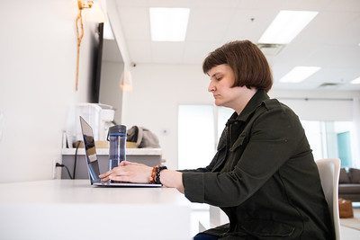 person working on a computer at a desk