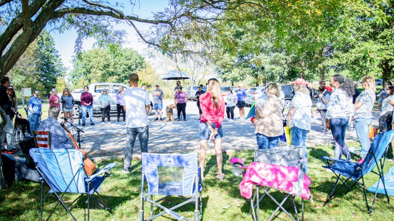 Photo of Wellness event participants standing in a circle